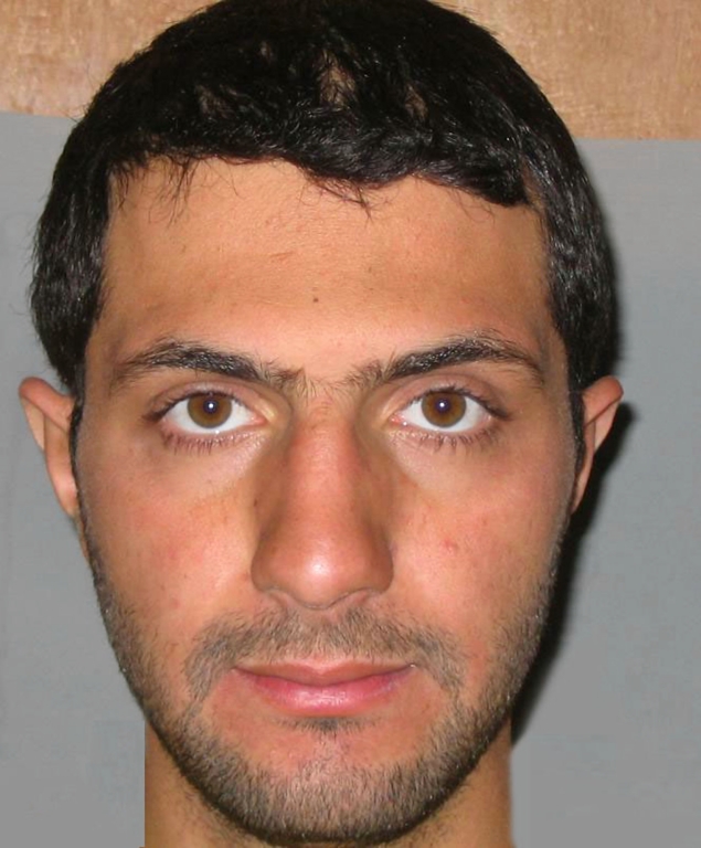 Mug shot of Abu Mohammad al-Julani in 2006, after his capture by U.S. forces in Iraq